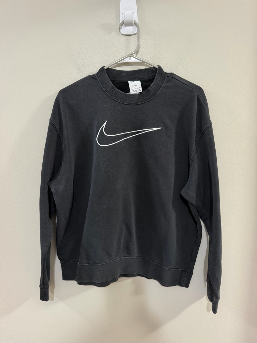 Nike Dri-FIT "Get Fit" Women's Graphic Crewneck Sweatshirt in Black/White.